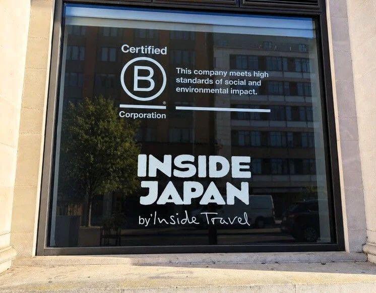 The finished result combines the character of the original building with clear, contemporary branding, creating an entrance that stands out without overwhelming its surroundings
